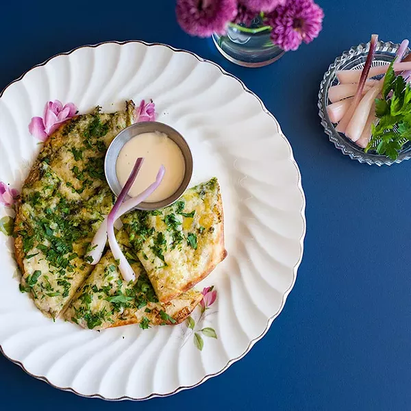 Garlic fingers made of house-made naan bread, ramp butter, Cows extra old cheddar and donair sauce - JESSICA EMIN