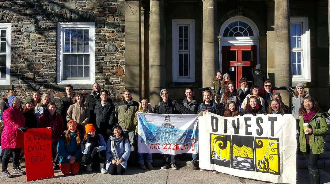 Activists celebrate last winter after the Dalhousie board of governors votes to look into divestment. - VIA DIVEST DAL