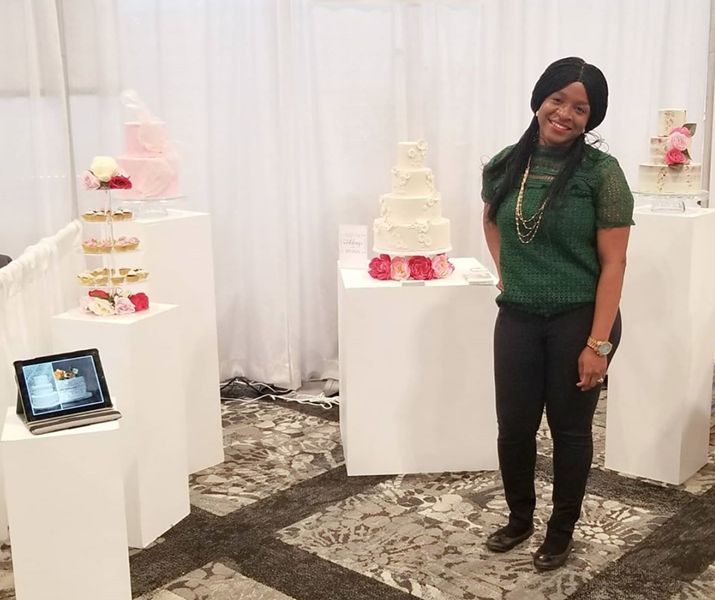 Temi Ologbenla shows off her cakes at a wedding expo. - INSTAGRAM
