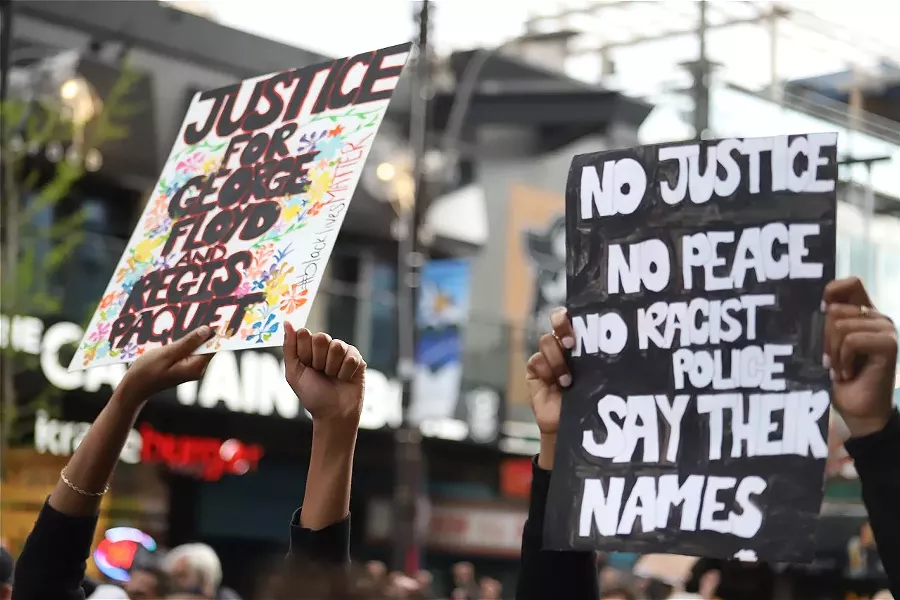 Signs at the June 2 Halifax protest for George Floyd, whose death at the hands of Minneapolis police has four officers charged with murder. - VICTORIA WALTON