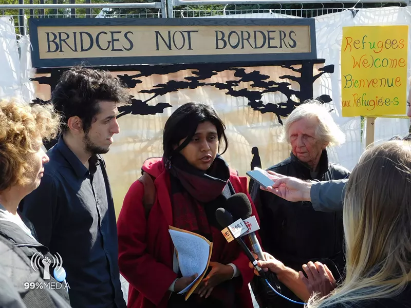 Stacey Gomez speaking at a press conference for a Refugees Welcome rally at Roxham Roxam Road, Quebec. October 1, 2017 - 99% MEDIA
