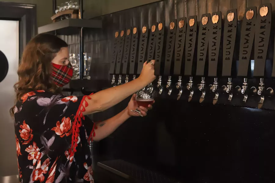 Cider House manager Shauna Krasuski pours a Bulwark Blush. - VICTORIA WALTON
