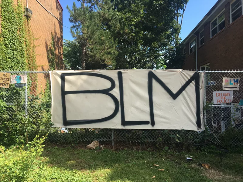 A new BLM sign hangs on the fence on Gottingen Street. - KATE MACDONALD