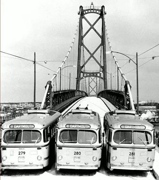 Nova Scotia Light and Power Company’s trolley buses provided the first public transportation across the harbour span. - HALIFAX HARBOUR BRIDGES
