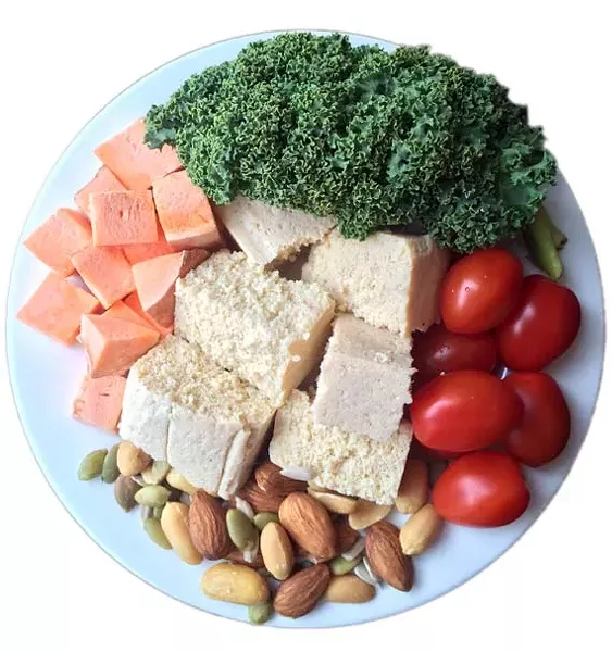 A typical day’s food intake for Tucker consists of eight to 11 servings of carbs (from starchy vegetables like sweet potato) and seven to nine servings of protein (from sources like tofu, chickpeas, nuts and seeds), combined with non-starchy veggies like kale and tomatoes, all spread out based on his training schedule.