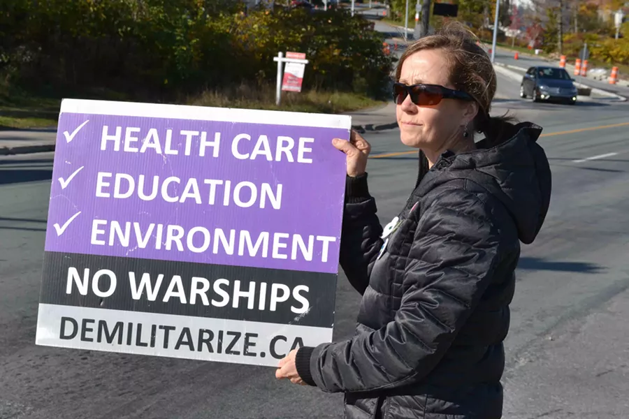 Tamara Lorincz, back in town and protesting outside the Irving Shipyard on Barrington Street on November 2. - THE COAST