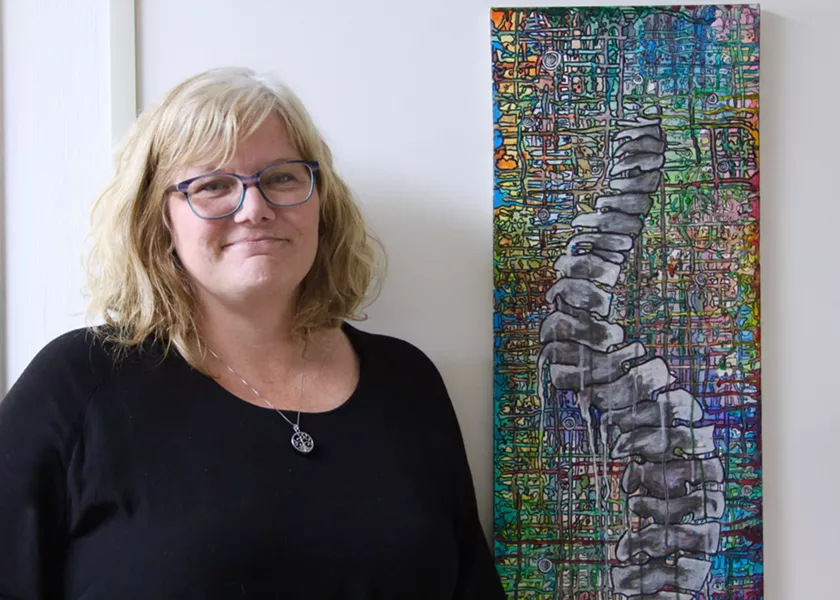 Jodi Myles, pictured here with a piece of Jordon's artwork. - KING'S COLLEGE INVESTIGATIVE WORKSHOP