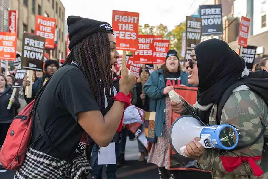 Jade Byard Peek (left) and Khan hype up their fellow students during last fall’s march against tuition fees. - PATRICK FULGENCIO