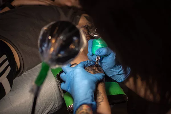 Newly enforced regulations might make tattoos less of a pain. - JOSHUA SAUNDERS