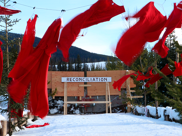 Red dresses hung along the road near the Unist'ot'en healing centre in BC. - AMANDA FOLLETT HOSGOOD
