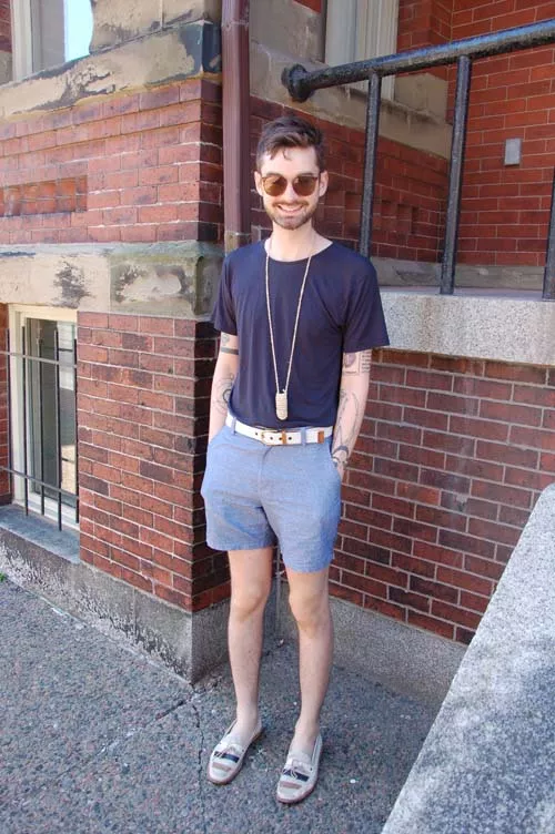 We’re not in the habit of chasing men down Barrington Street, but we made an exception for Colby. It wasn’t a surprise to learn he has a big collection of accessories; love the pairing of the white belt with the knotted neckpiece and those striped casual loafers. Colby’s intricate tattoos demonstrate how ink can work as personal style, too.