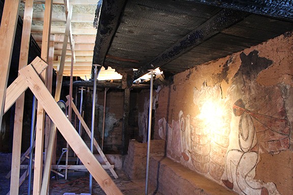 One of the damaged frescos and reconstruction equipment in the DeGrazia chapel.