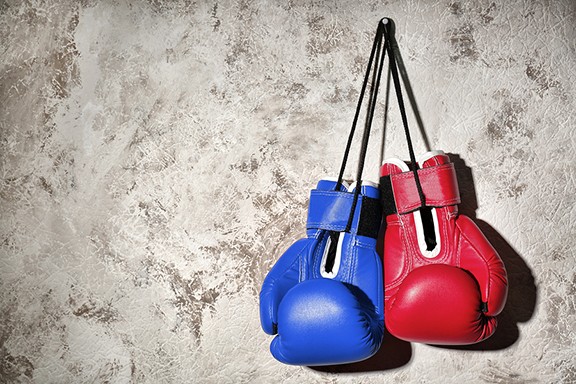 bigstock-red-and-blue-boxing-gloves-han-228079651.jpg