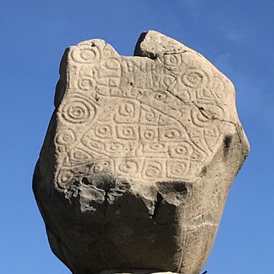 A petroglyph originally found in the floodplain is now the focal point of a statue in a major plaza in Banámichi, Sonora
