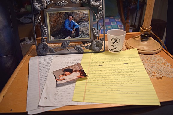 Carrie Walker’s son was murdered in Pima County Jail. She remembers him through his letters and photos. - DANYELLE KHMARA