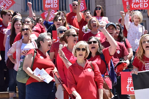 Tucson Magnet High educators rally in front of the downtown high school on Saturday, April 14. - DANYELLE KHMARA