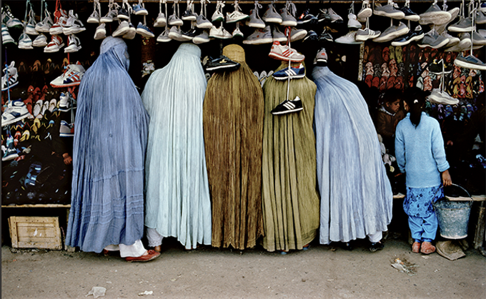 “Afghan Women at Shoe Store,” Kabul, 1992, by Steve McCurry, whose work will be on display at Etherton Gallery from Sept. 7 though Nov. 10. - COURTESY PHOTO