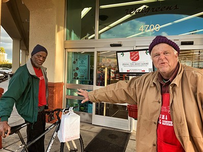 Gregory Lewis the bell ringer and Charles at a Salvation Army “Red Kettle” outside of Walgreens. - BRIAN SMITH