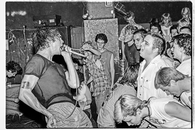 "Black Flag at The Backstage on 4th Ave., May 13, 1983. I got on stage next to Greg Ginn soon after they started playing because I knew taking photos in front of the stage would have been difficult with the crowd movement. Luckily no one kicked me off stage." - ED ARNAUD