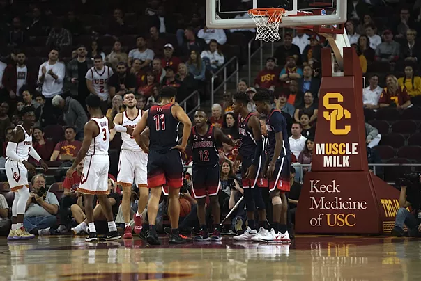 Members of the Arizona basketball team mill about the court at Galen Center during the team's 80-57 loss to Southern California on Thursday. - CONNOR BUSS, FOREWORD FILMS