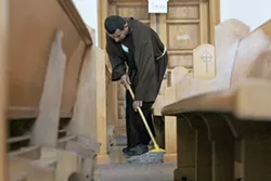 Hermano Juan, a monk who drives up to Tucson from Elfrida with some of his colleagues, helps keep the monastery clean. “We go outside the community,” he says. “Our goal is to reach out to those in society that nobody wanted.” - LOGAN BURTCH-BUSS