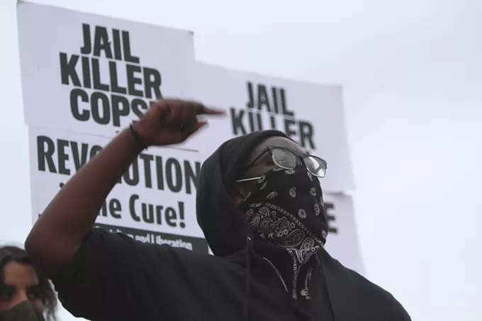 After the vigil, a group of provocateurs overtook the stage to express their point of view on problems African-Americans face with law enforcement. "Voting isn't going to do shit. We should not have to vote to be seen as a fucking human being. There's no such thing as a good cop. All cops are bad cops," said the woman pictured above. "Their job is to murder us. This whole 'be peaceful'...they killed those niggas in peaceful situations. Peace isn't gonna get us nowhere. We've been fucking peaceful. They're the ones to escalate." - AUSTIN COUNTS