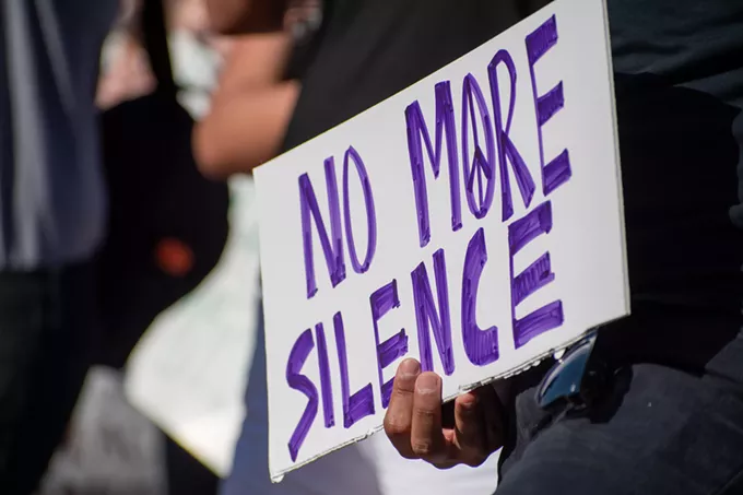 No more silence was a coming theme, both among speakers at Wednesday's demonstration, and on attendees’ signs. - LOGAN BURTCH-BUUS