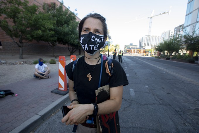 Lily Pavy, 24, dons an “I can’t breathe” mask during the rally, a call back to the last words uttered by George Floyd before he was killed by former Minneapolis police officer Derek Chauvin. Pavy, who works at the Tucson Wildlife Center, found out about the rally through Social Media said, “I’m glad to see people take the Fourth of July to come out and fight for what they believe in.” - JOHN DE DIOS