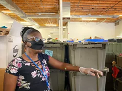 Tawana Brown, working in the back of the store. “When I was a girl, I dreamed of living in - an apartment like mine,” Brown says. “I never thought I would ever be where I am.” - BRIAN SMITH