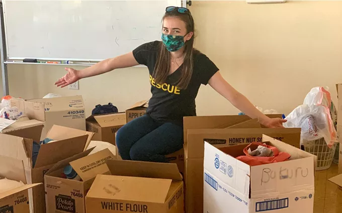 Bridget Ott, a senior health caseworker, prepares care packages for refugee families in Phoenix. Emergency care packages have been delivered to about 3,000 individuals in both Phoenix and Tucson since March. (Photo courtesy of International Rescue Committee