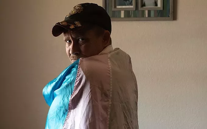 Blue Montana wears his hat with the Marine Corps logo sewed onto the front with pins attached to the bill that read \"not as lean not as mean but still a marine\" and \"always faithful.\" - PHOTOS BY RACHEL STAPHOLZ/CRONKITE NEWS