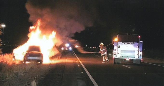 In Santa Cruz County just before Christmas, a U.S. citizen driver sped away from Border Patrol’s I-19 checkpoint north of Nogales. The car caught fire. Agents pulled two illegal crossers from the trunk before they burned up. - COURTESY U.S. BORDER PATROL