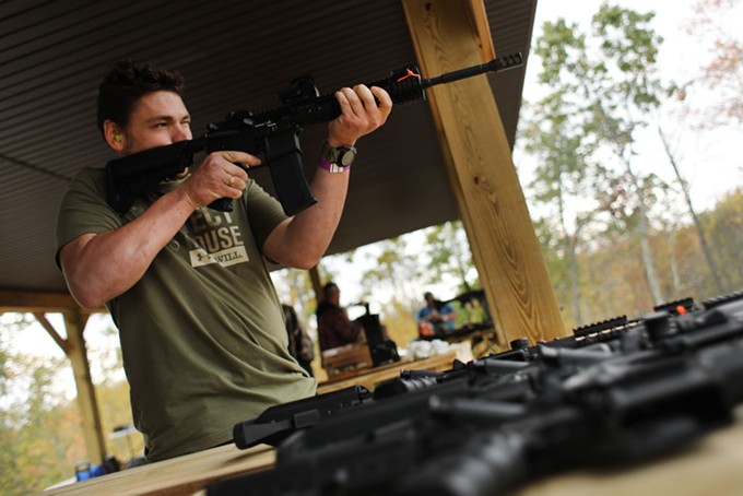 Members of the public shoot AR-15 rifles and other weapons at a shooting range during the “Rod of Iron Freedom Festival” on October 12, 2019 in Greeley, Pennsylvania. The two-day event, which is organized by Kahr Arms/Tommy Gun Warehouse and Rod of Iron Ministries, has billed itself as a “second amendment rally and celebration of freedom, faith and family.” Numerous speakers, vendors and displays celebrated guns and gun culture in America. - PHOTO BY SPENCER PLATT | GETTY IMAGES