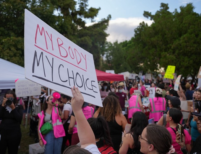 Abortion-rights activists gather at the Arizona Capitol on June 24, 2022, to protest the Supreme Court’s ruling overturning Roe v. Wade. - (TROY HILL/CRONKITE NEWS)