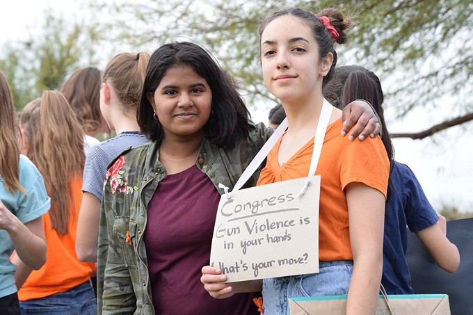 A group of eighth-grade girls at Orange Grove Middle School organized a March 14 walkout, calling for lawmakers to enact better gun regulation.
