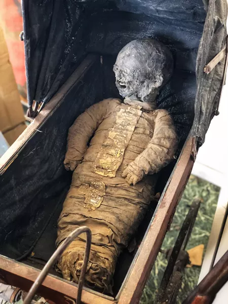 A baby mummy in Ratkevich's house. - BRIAN SMITH