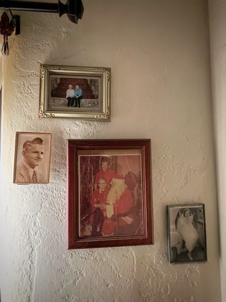 Family pictures on Billy's wall. - BRIAN SMITH