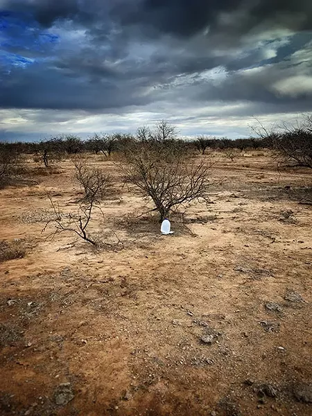Water and food for migrants left by Tucson Samaritan volunteers. - PHOTOS BY BRIAN SMITH