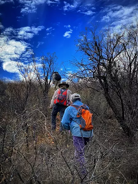Ron, Andres and Alvaro move toward a death site. - PHOTOS BY BRIAN SMITH
