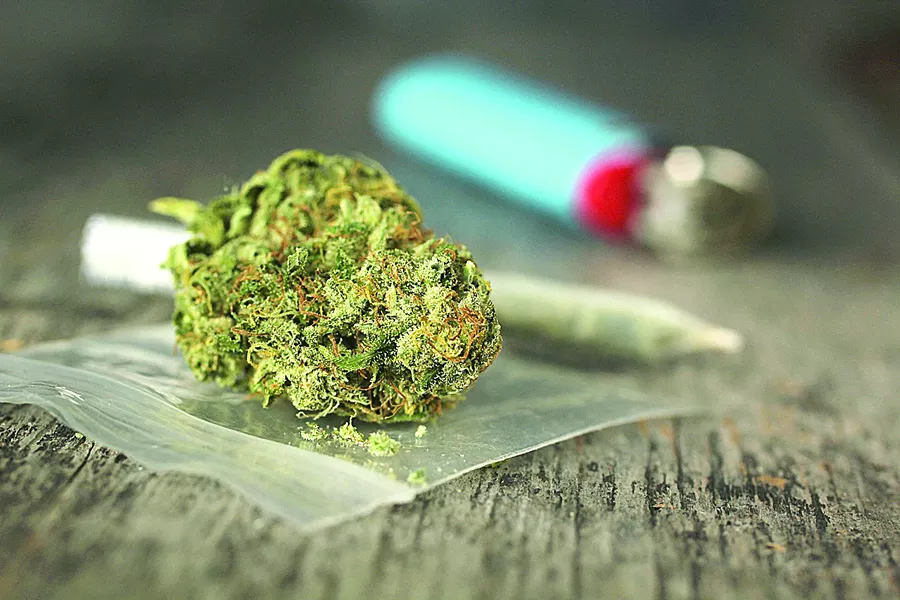 bigstock-closeup-of-marijuana-joint-and-83176226.jpg