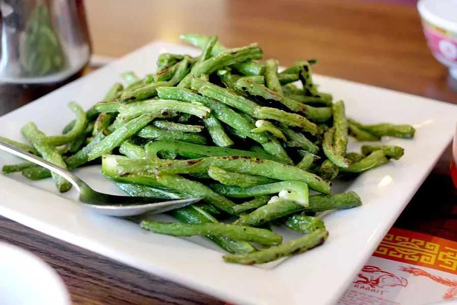 These sautéed green beans pack a spicy punch with jalapenos added. - HEATHER HOCH