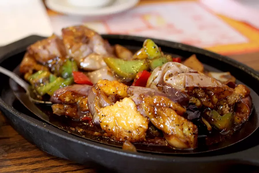 Sizzling shrimp with soft eggplant is a unique dish with tons of flavor. - HEATHER HOCH