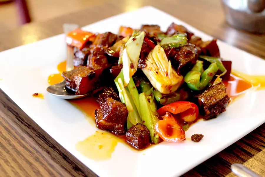 Braised pork belly will have you singing this spot’s praises. - HEATHER HOCH