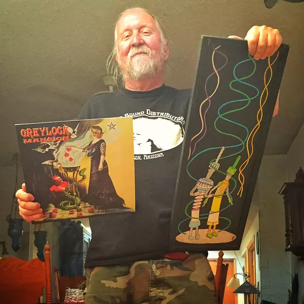 Steve Purdy with his Greylock Mansion album cover and a trash-art piece he calls "The Transmission People." - BRIAN SMITH