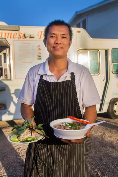 Nhu Lan’s owner Nghia Tran dishes up pho dac biet. - JD FITZGERALD