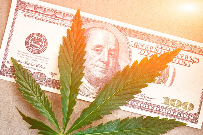 bigstock-sheet-of-marijuana-money-with-204989893.jpg