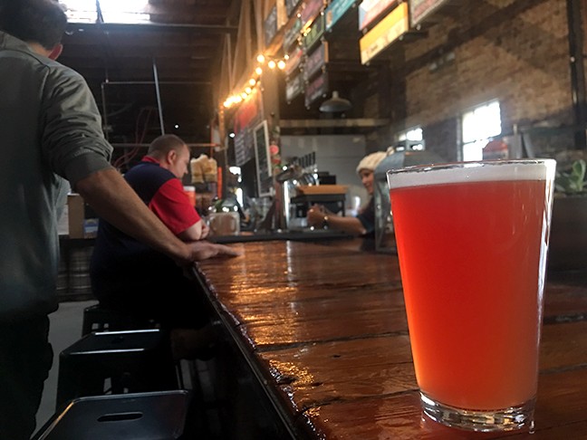 The Prickly Pear Wheat at Borderlands Brewing Company has a rosy red hue and a light, bready flavor highlighted by the crisp sweetness of prickly pear.